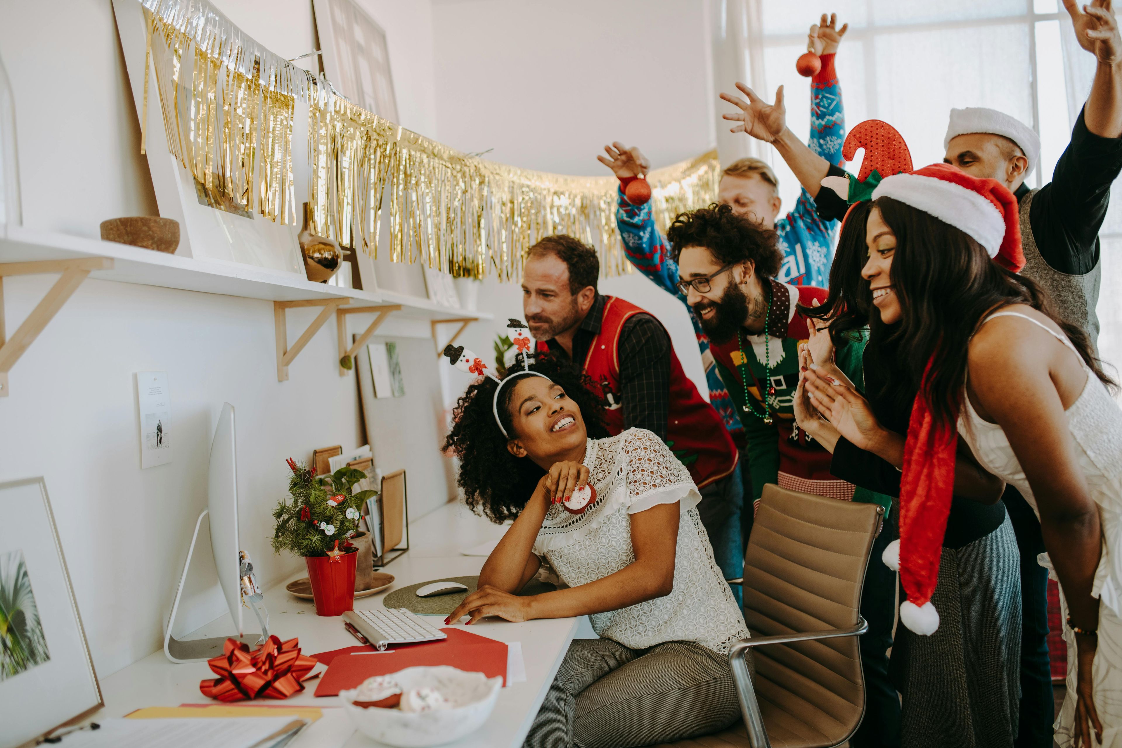 Photo by RDNE Stock project: https://www.pexels.com/photo/a-group-of-people-celebrating-christmas-greeting-someone-on-a-video-call-6519373/